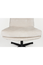 Fauteuil pivotant capitonné à carreaux